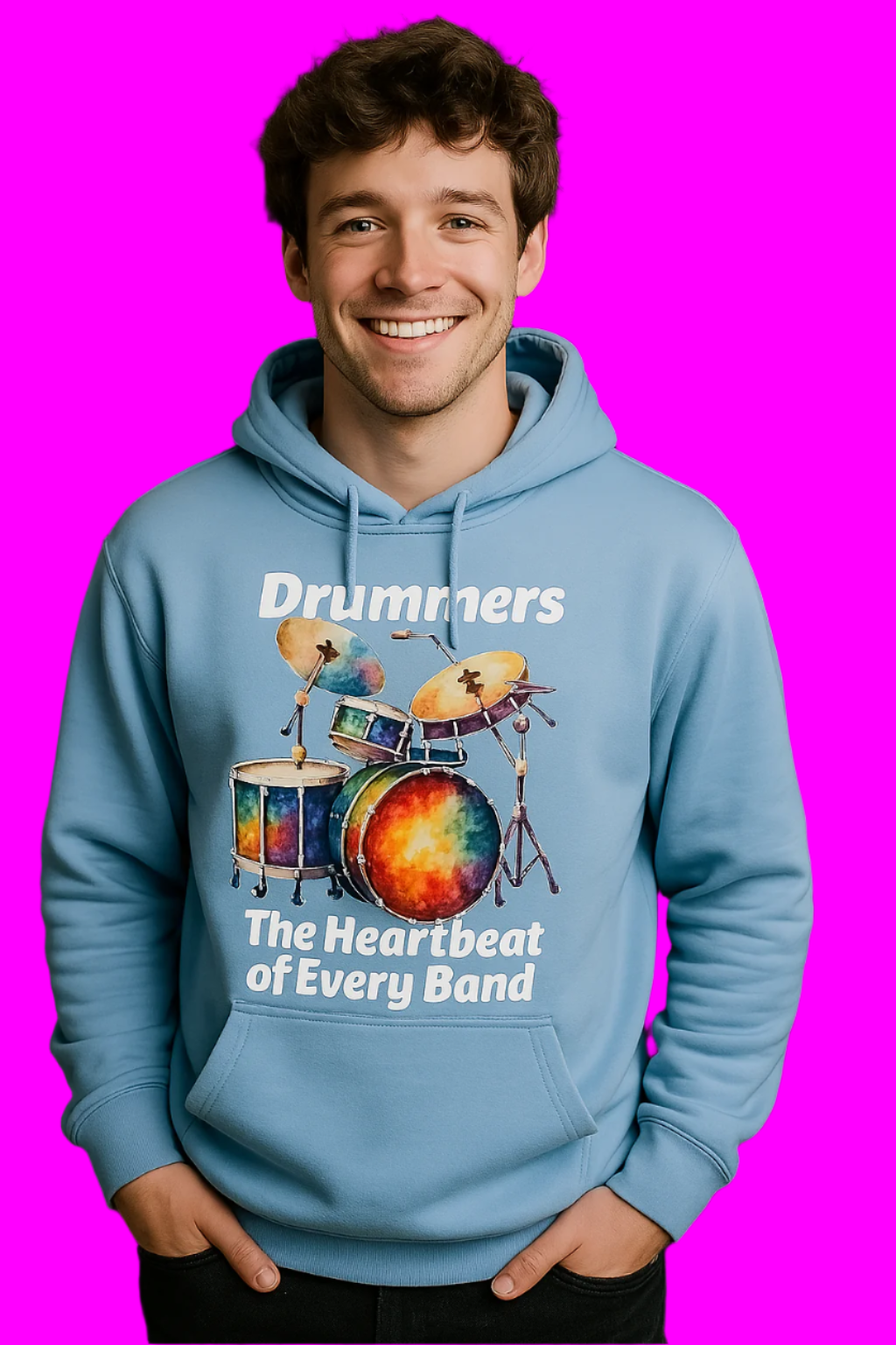 Person wearing a blue hoodie with a drum design and text, standing in front of a drum set.