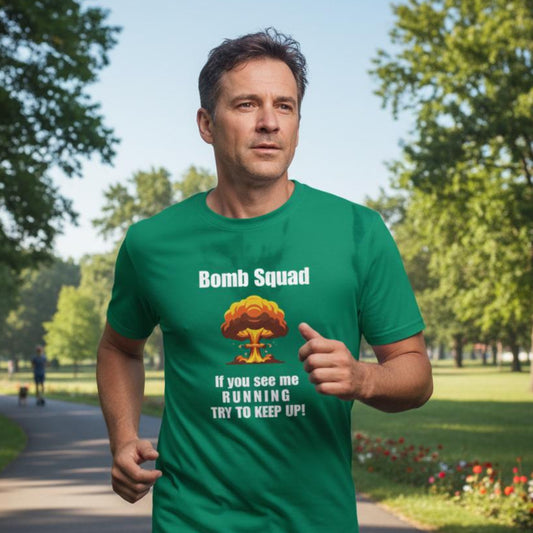 Man running in a park wearing a green t-shirt with 'Bomb Squad' text and graphic.