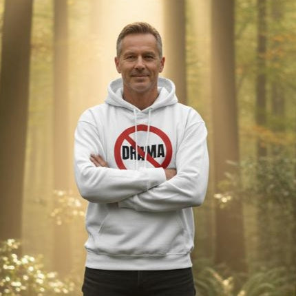 Man wearing a hoodie with 'No Drama' design in a forest setting