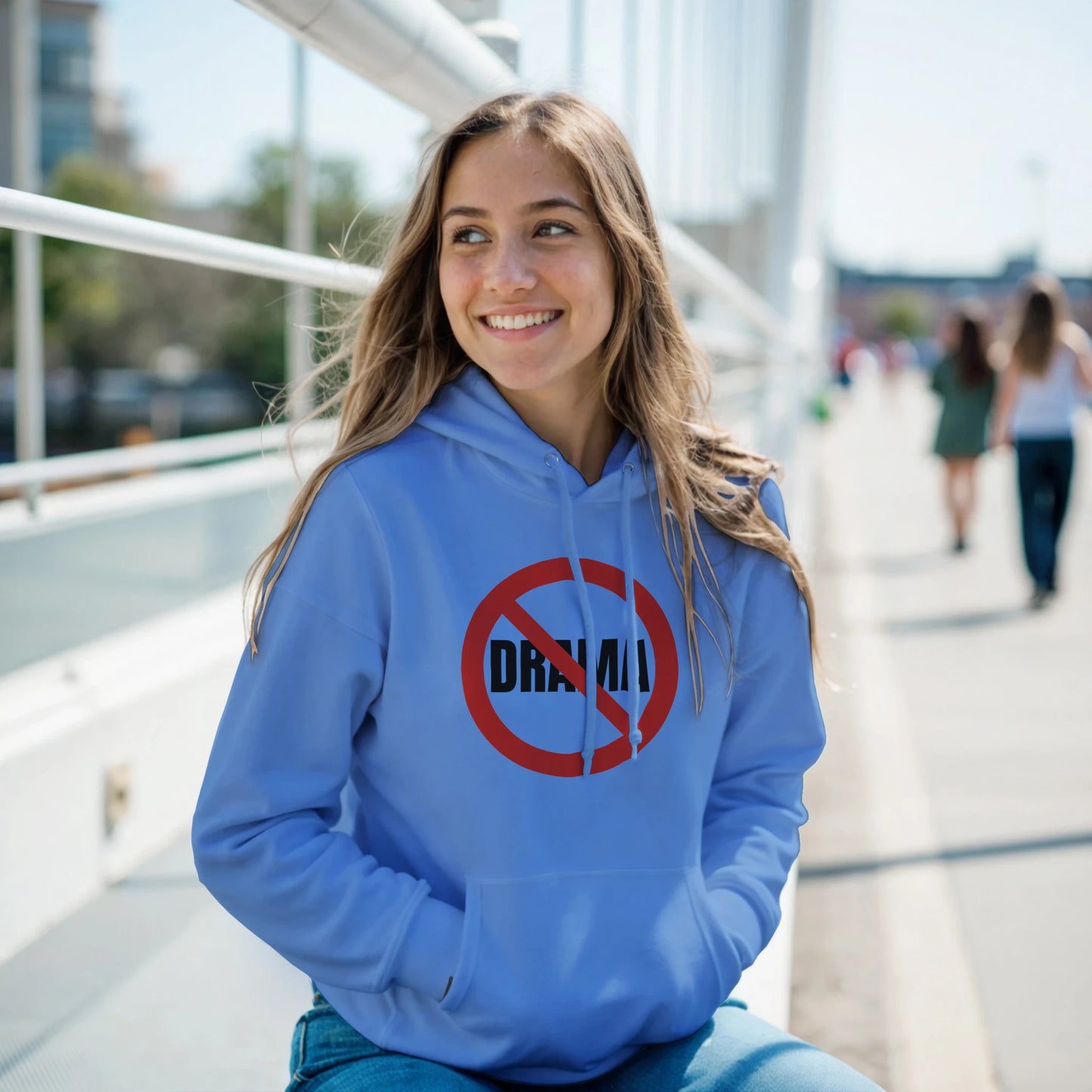 Woman wearing a blue hoodie with a 'No Draw' symbol 